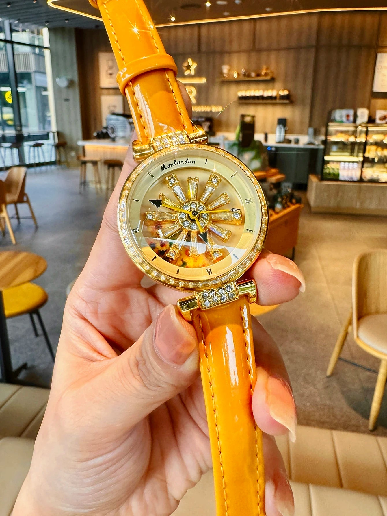 Montre élégante pour femmes, dos transparent, diamants incrustés, cadran galactique rotatif, Design Sunflower, boîtier en acier inoxydable, bracelet en cuir orange, montre à quartz étanche pour les rencontres des fem
